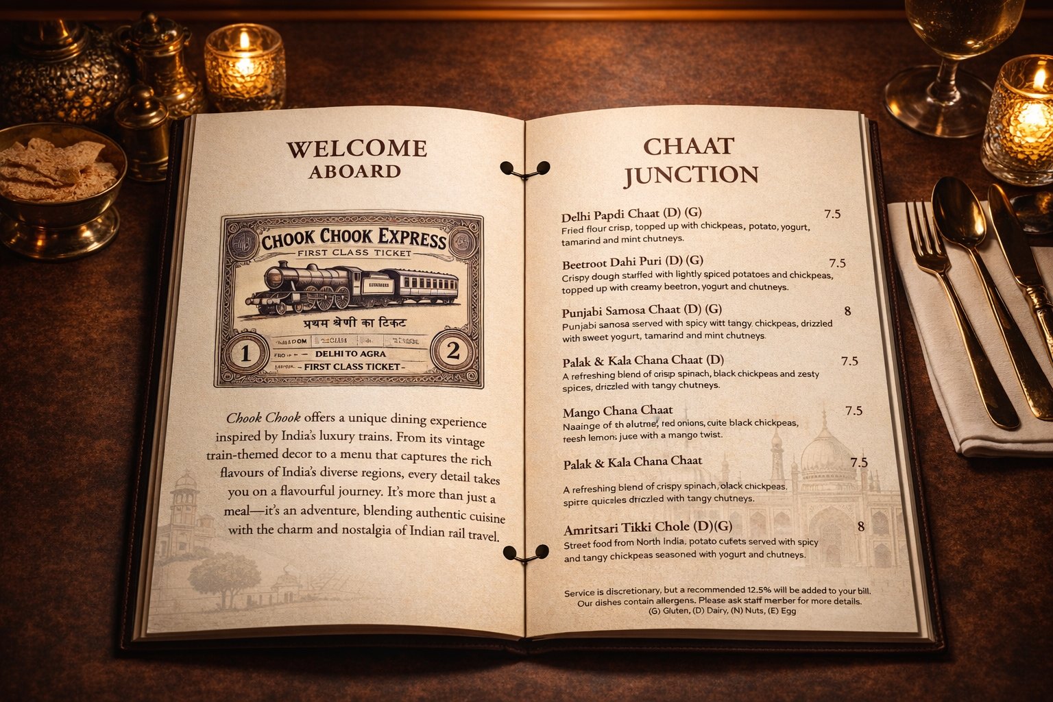 The Chook Chook food menu lying open on the table at Welcome Aboard and Chaat Junction, bound with two black rings through punched holes at the spine