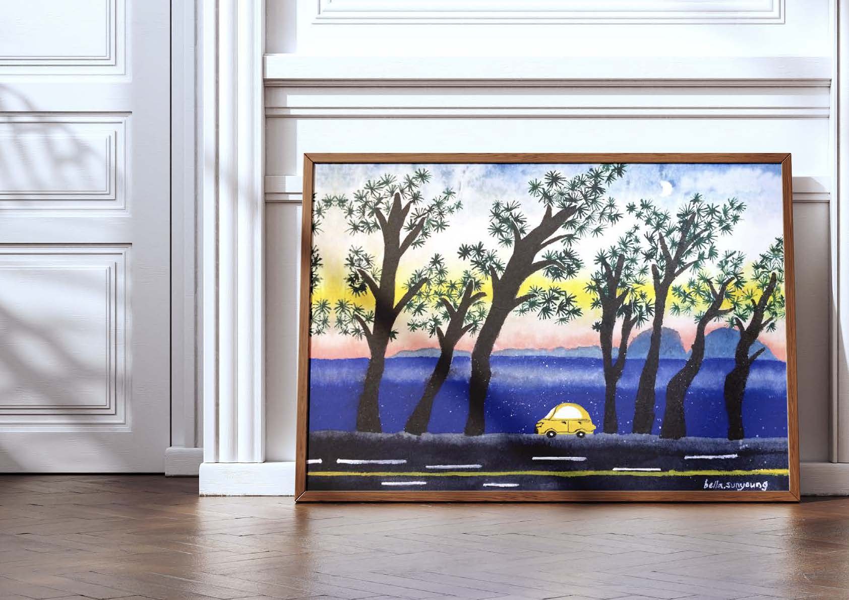 Watercolour of a yellow car on a coastal road lined with tall trees at sunset, framed and leaning on a wall